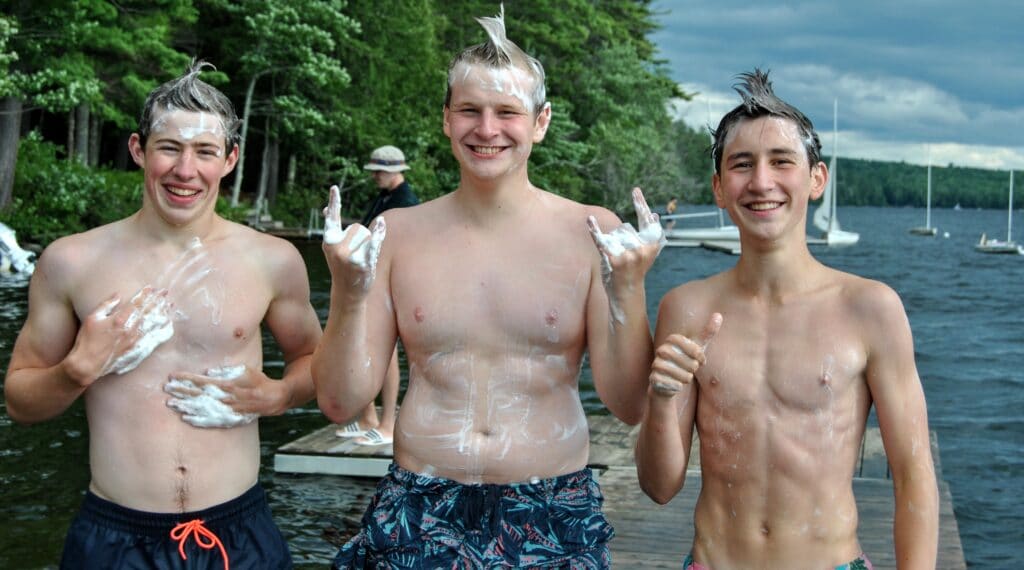 3 Birchrock campers smiling on the dock