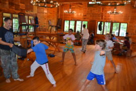 Campers learning how to do karate.